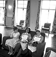 Off-duty nurses relaxing in the common-room during