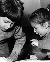Young boy and girl playing .
1950s