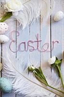 Easter arrangement of eggs, feathers, flowers & 'E