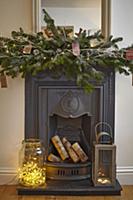 Fairy lights in large glass jar and lantern on hea