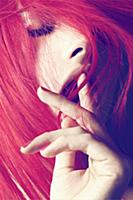 A young woman with red hair, close-up