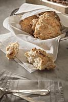 Cheese biscuits wrapped in napkin in a serving vow