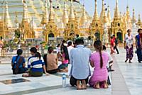 MYANMAR / Yangon / 2015 / Buddhists praying in fro