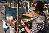 MYANMAR / Yangon / 2015 / Betel leaves are spread 